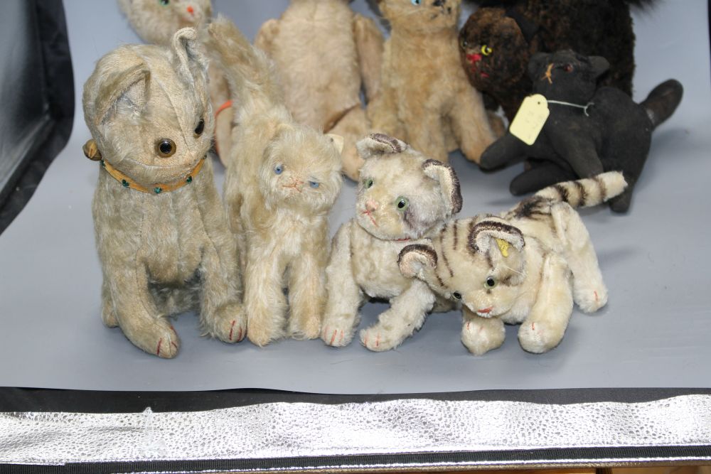 A collection of nine assorted vintage and later soft toy cats including Steiff